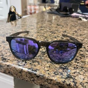 Oakley Black and Purple Sunglasses with Sleek Frame and Vibrant Lenses